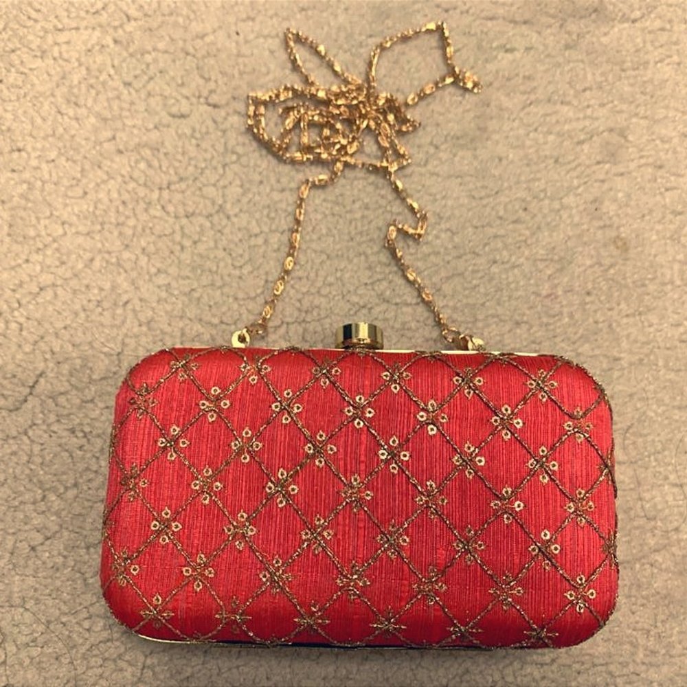 Decorative purse with metallic clasp